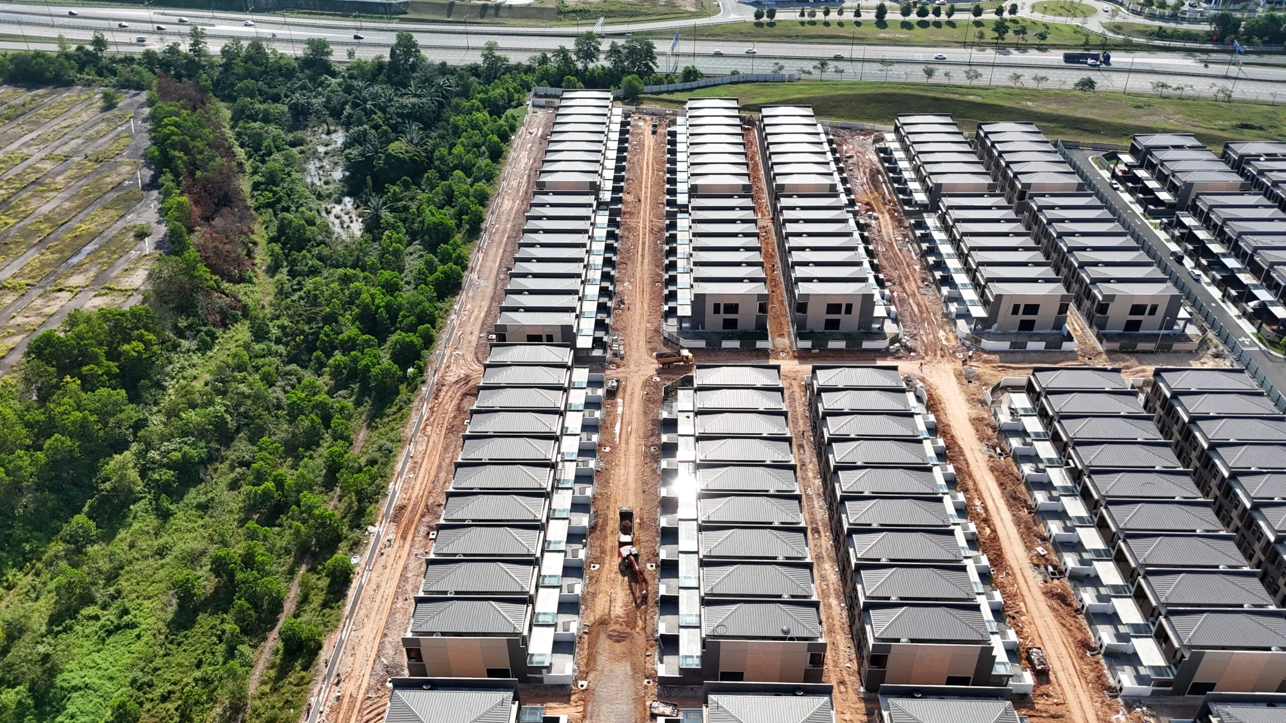 Aurora Resort Villas streets and villa rows under construction, July 2025 drone photograph, Iskandar Puteri