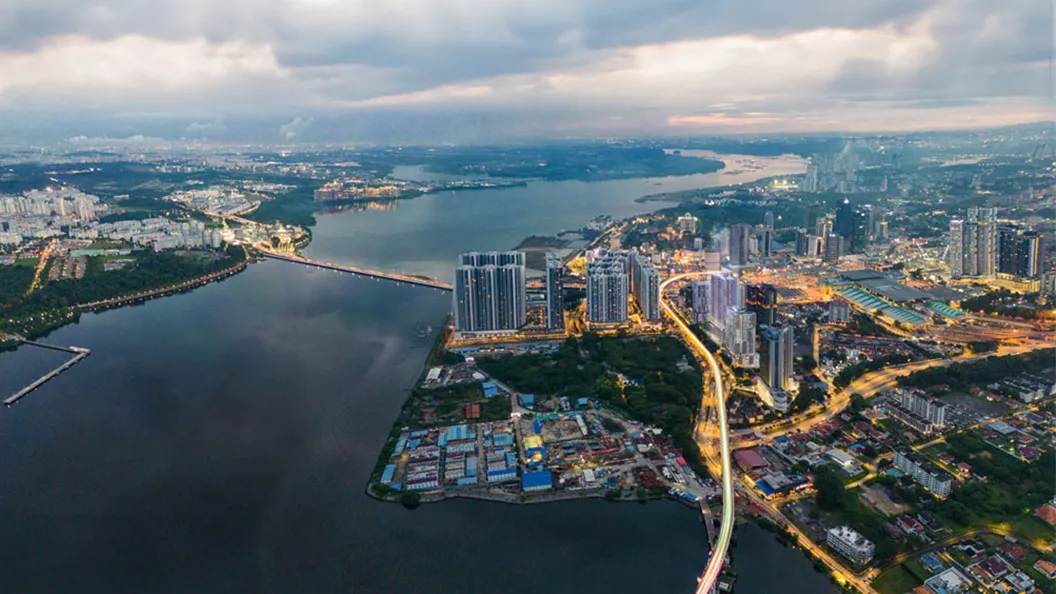 Aerial artist's impression of Summer Suites Johor Bahru looking towards the CIQ complex and the Causeway