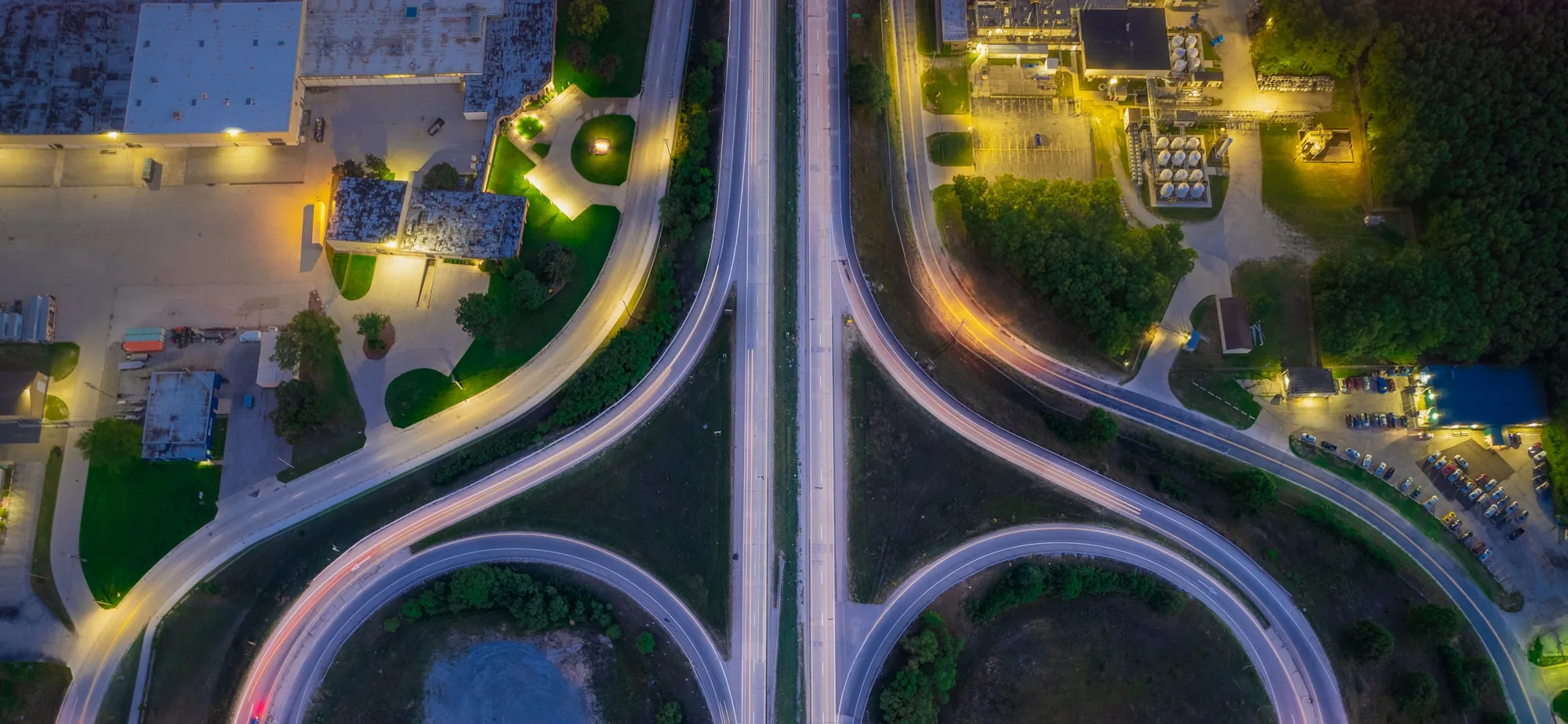 Highway interchange from the air, representing the central dispatch advantage of the Kempas belt