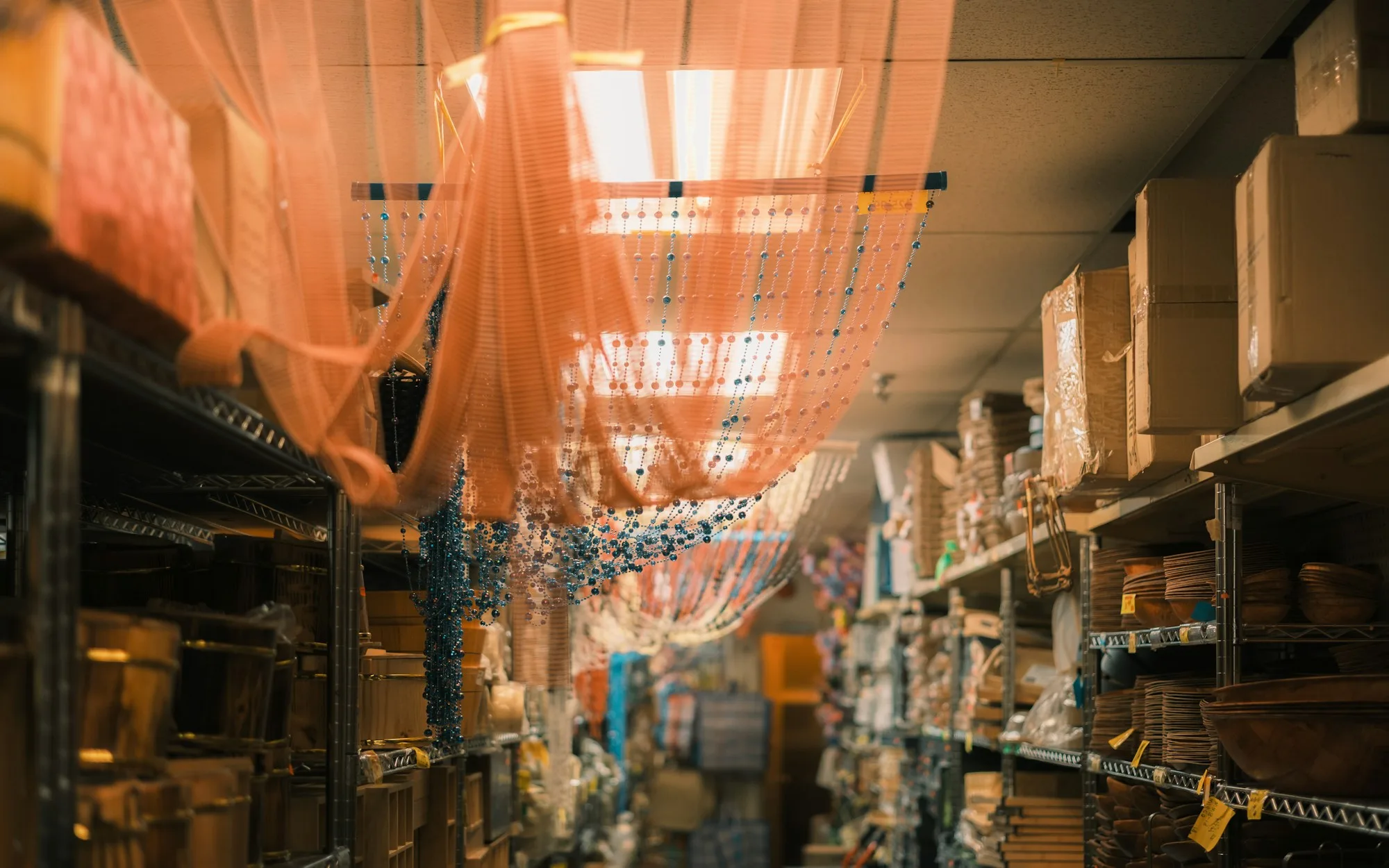 Storage shelving and stock, representing the warehousing and port-support work of this belt