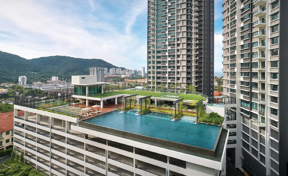Alila 2 facilities podium with swimming pool and rooftop pavilion against Penang Hill, Tanjung Bungah — actual photo