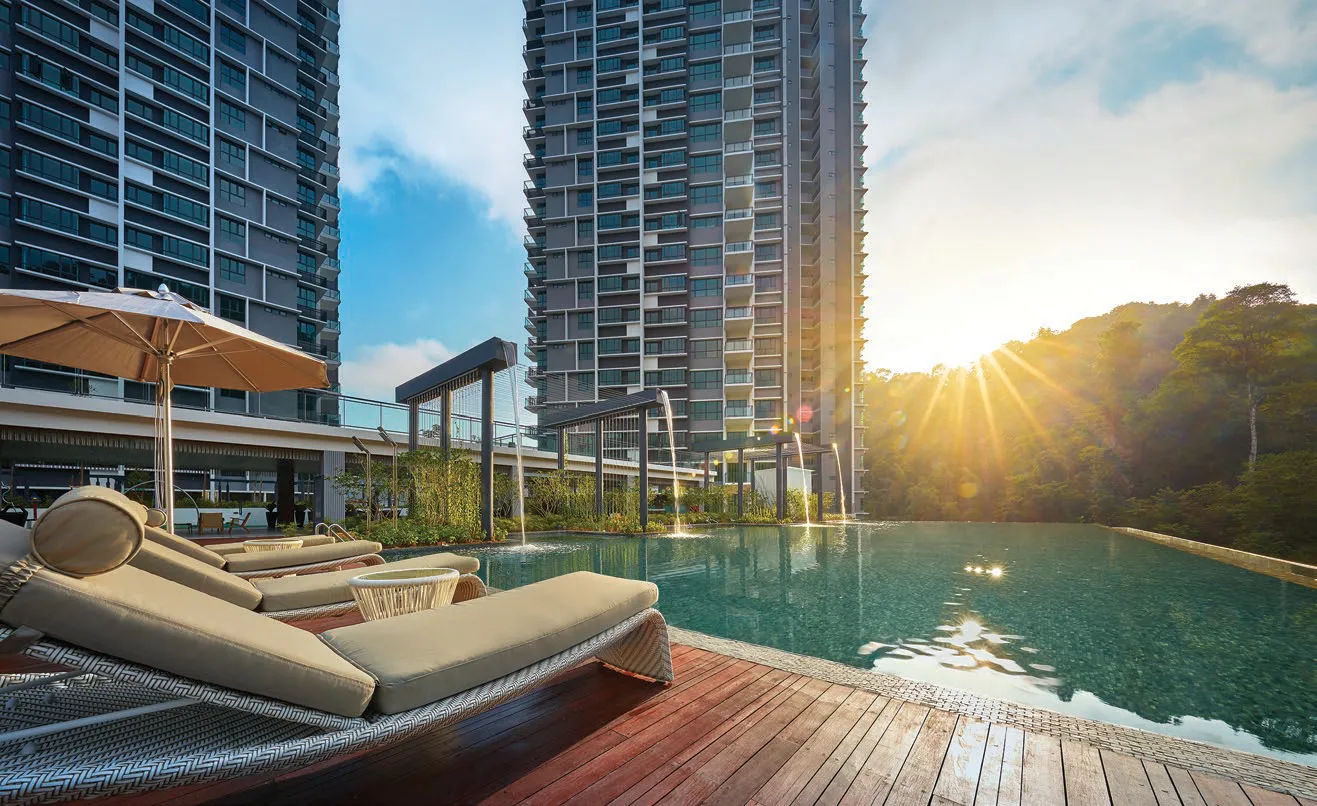 Alila 2 infinity pool deck with sun loungers between the two towers, Tanjung Bungah, Penang — actual photo