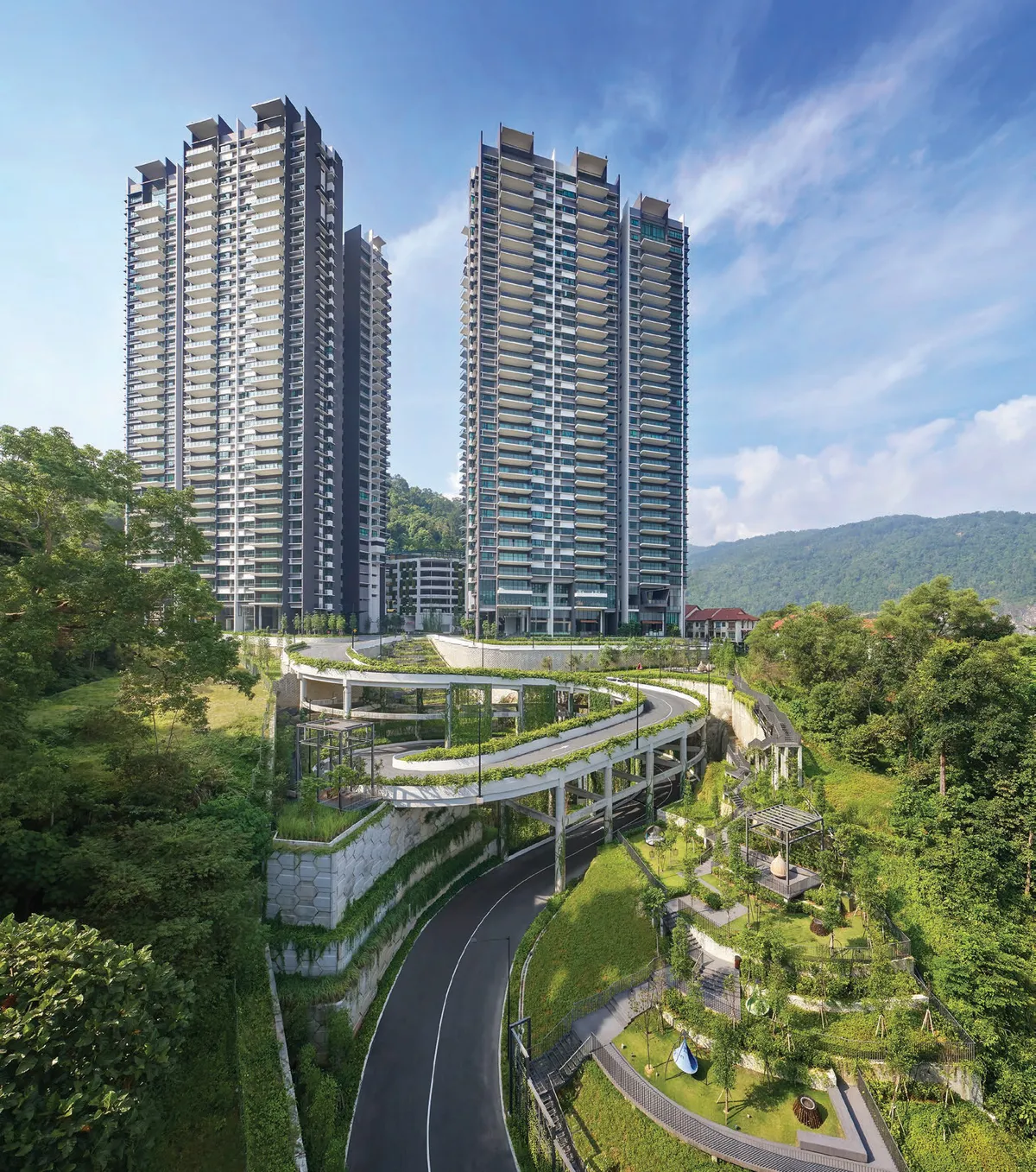Alila 2 Tower 1 and Tower 2 condominium towers above the landscaped hillside driveway, Tanjung Bungah, Penang — actual photo