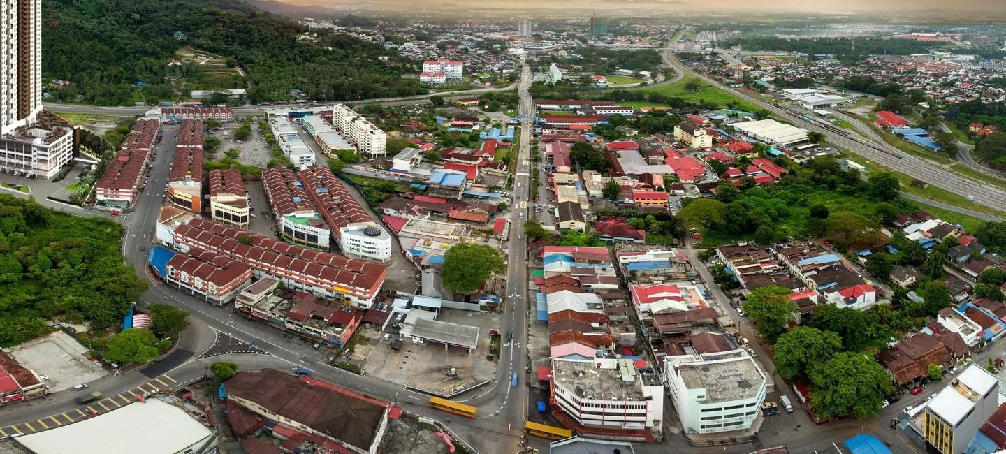 Bukit Mertajam town centre shophouse streets east of Aston Acacia, with the North–South Expressway corridor, Penang — aerial view