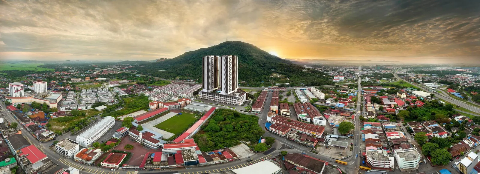 Aston Acacia twin towers and shop-office podium in Bukit Mertajam town centre with Bukit Mertajam hill behind, Penang — developer's aerial view