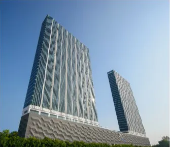 City of Dreams towers by day showing the diamond-pattern facade and podium, Tanjung Tokong, Penang