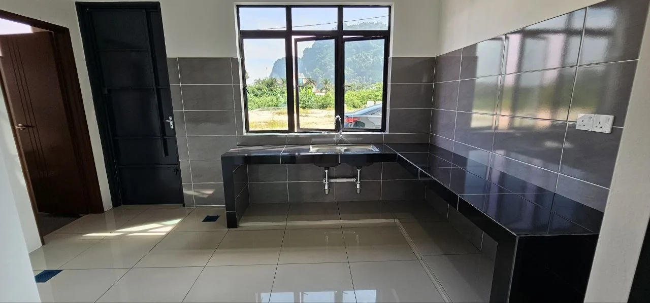 Wet kitchen with tiled worktop in the terrace show unit at Ampang Cove by LYS Realty Sdn Bhd, Ampang, Ipoh, Perak