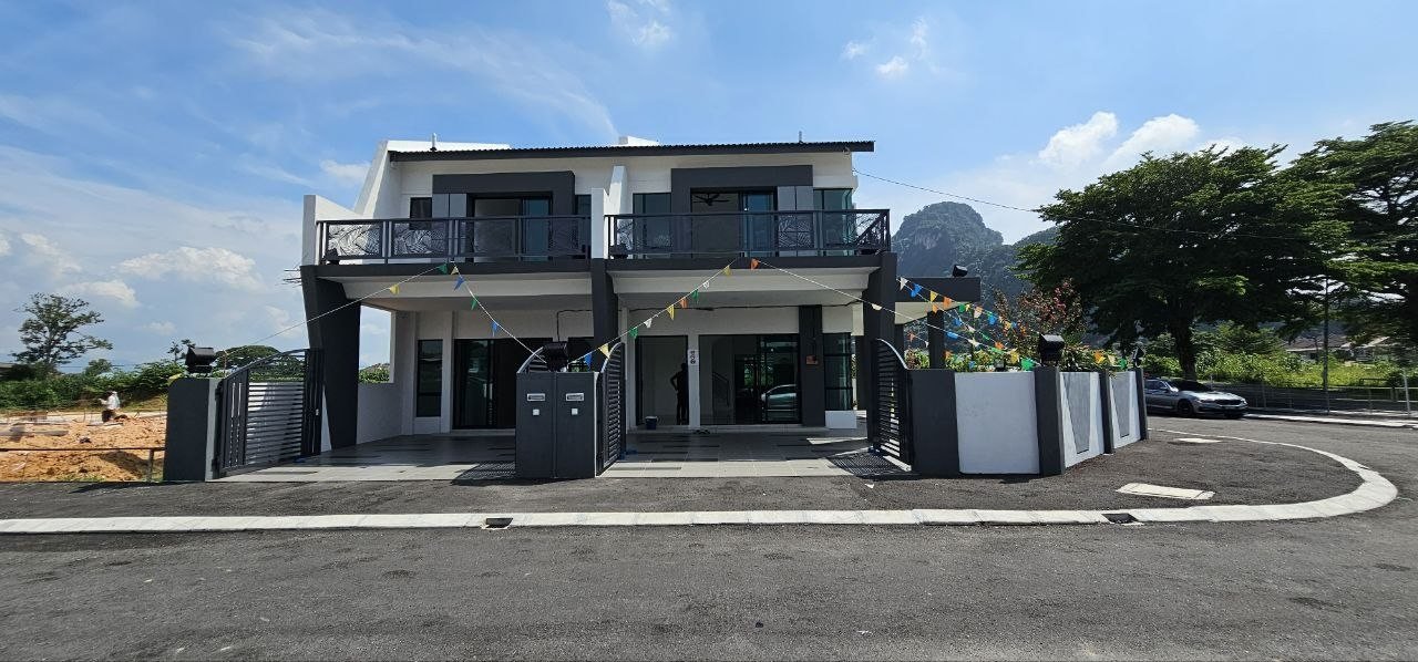 Double-storey terrace show units seen from the estate road at Ampang Cove by LYS Realty Sdn Bhd, Ampang, Ipoh, Perak