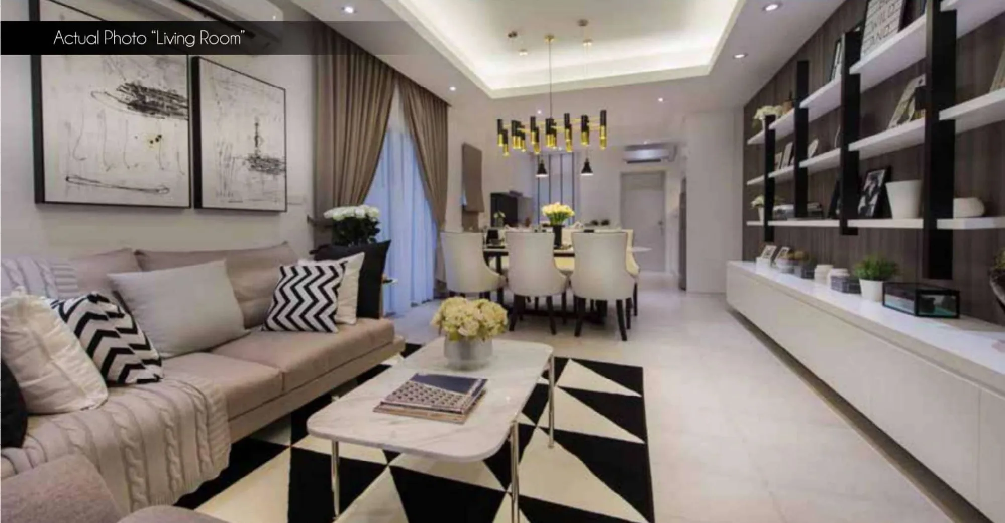 Furnished show-house living and dining area, photograph from the developer’s brochure at Bandar Sri Indah, Jalan Apas, Tawau, Sabah