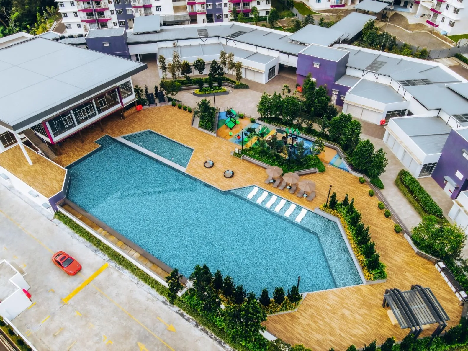 The 50-metre infinity pool, playground and gymnasium on the facilities deck, from the developer’s brochure at Bukit Bantayan Residences, Inanam, Kota Kinabalu, Sabah