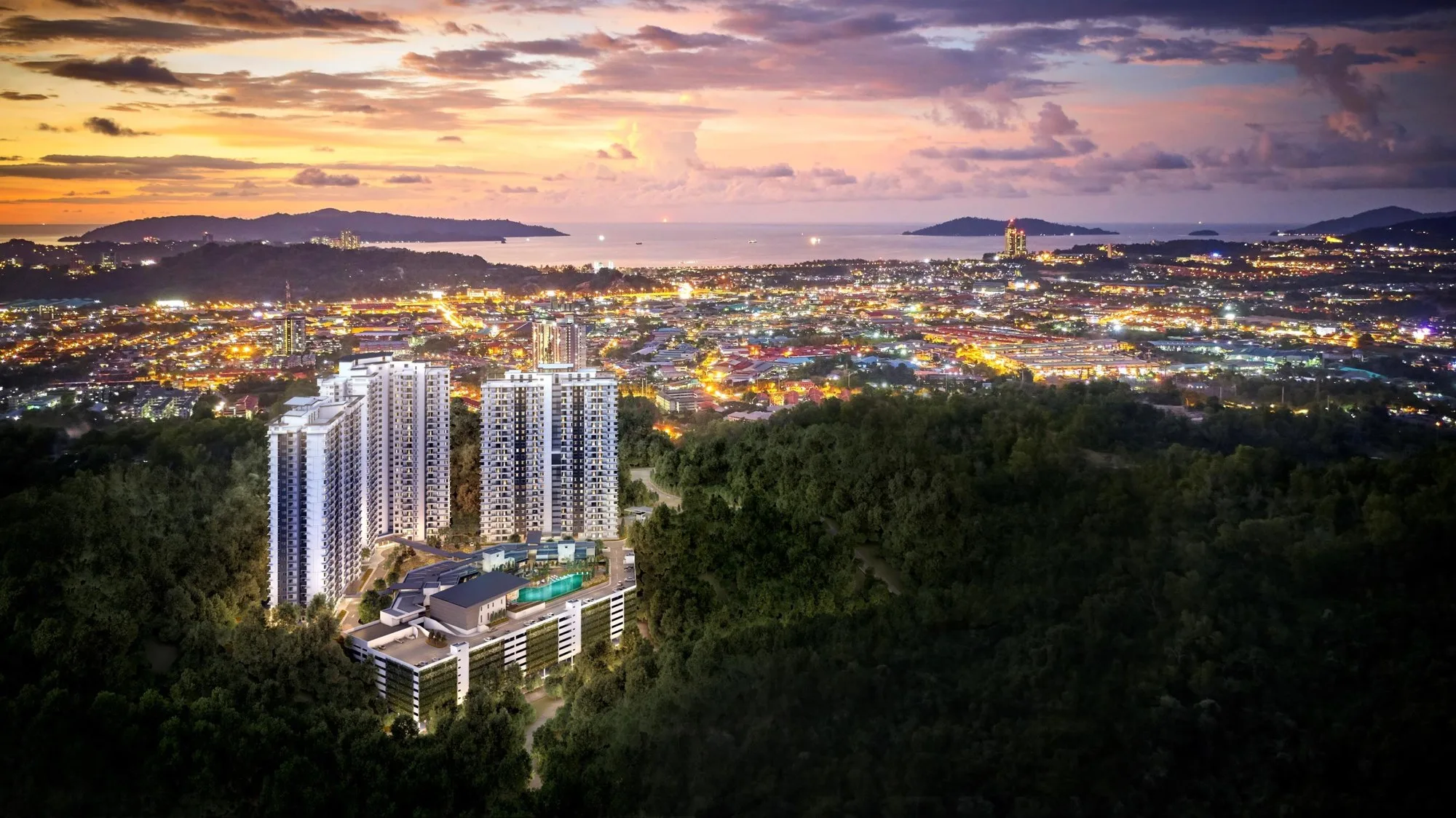 Artist’s impression: the development at dusk with the city lights and the sea beyond, from the developer’s brochure at Bukit Bantayan Residences, Inanam, Kota Kinabalu, Sabah