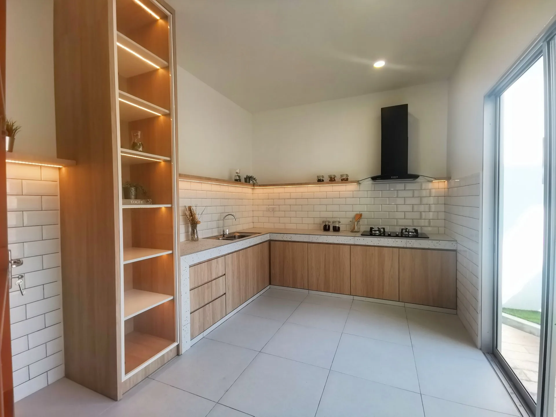 Kitchen of the Desa Park Chemor show house with sliding door to the rear yard, Chemor, Ipoh
