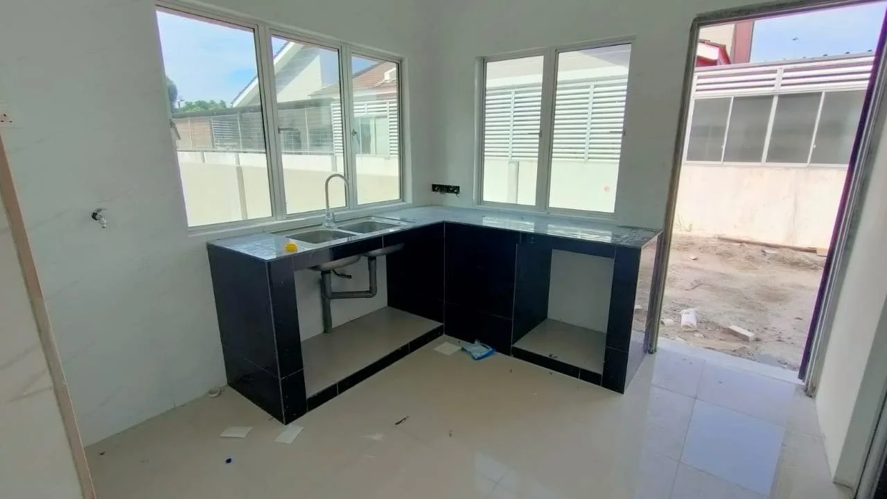 Wet kitchen with fitted base cabinets in a completed terrace house at Desa Tekkah Sentosa, Taiping, Perak