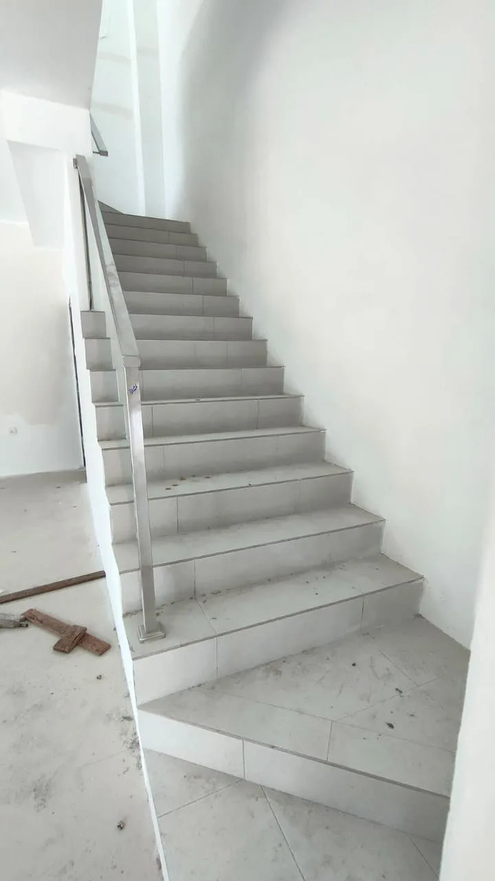 Staircase with steel railing in a completed terrace house at Desa Tekkah Sentosa, Taiping, Perak