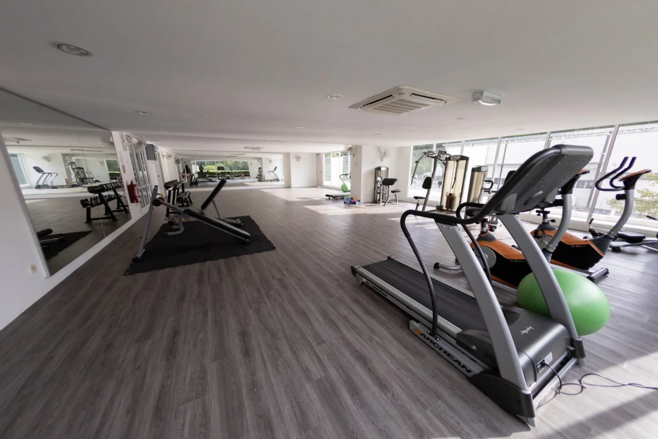 Emerald Residence gymnasium with treadmill, weights and exercise bikes, Teluk Kumbar, Penang