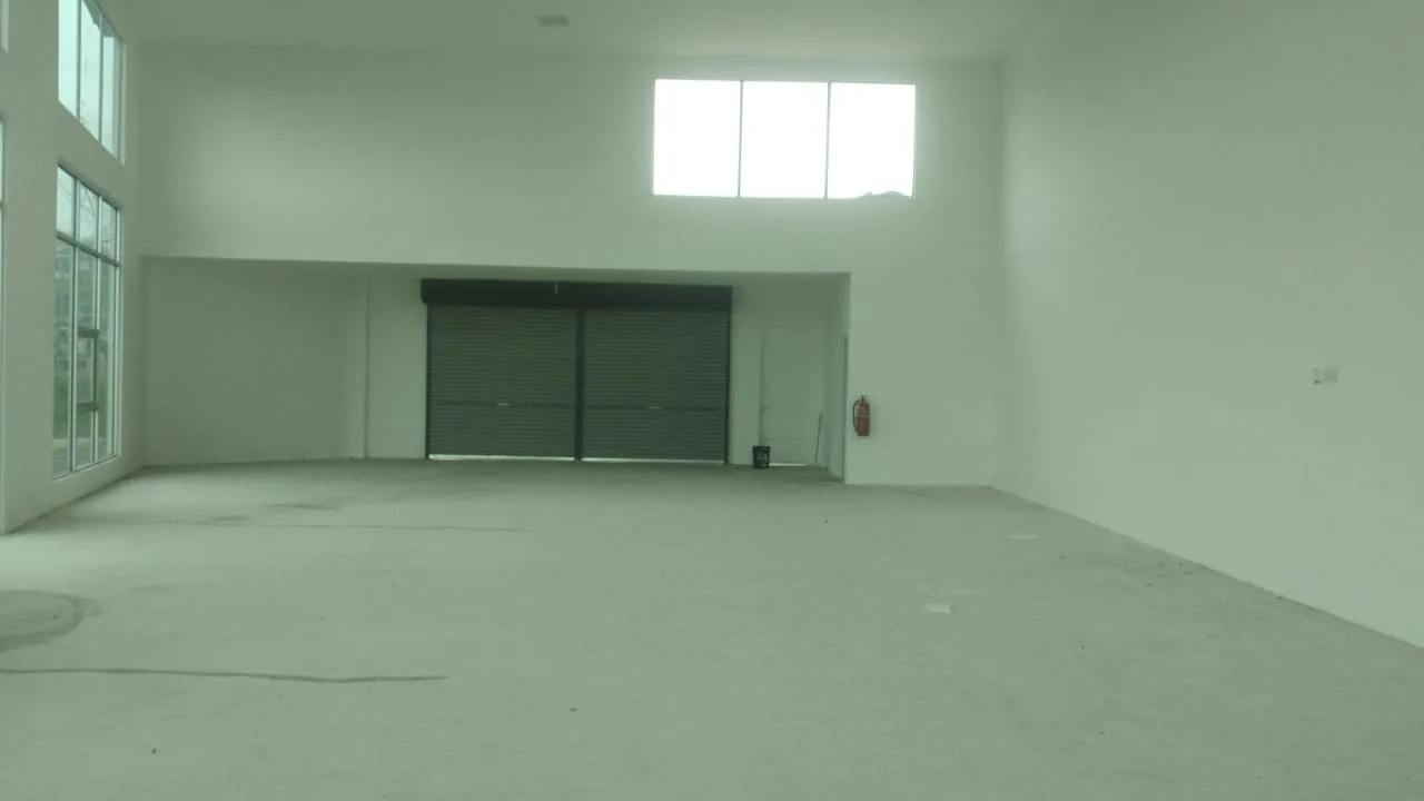 Open-plan shop office interior with rear roller shutter at Galleria By The Lake by Excellent Realty, Waterfront City, Bandar Lahat Mines, Lahat, Ipoh, Perak