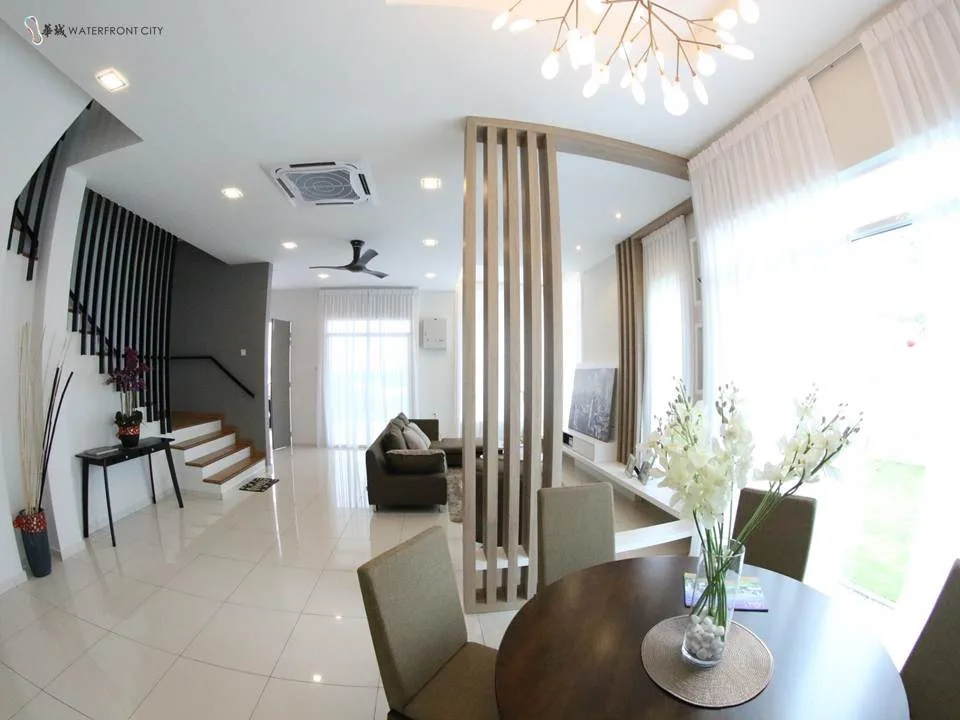 Ground-floor living and dining area with staircase in a Hillpark Residences show unit, Lahat, Ipoh, Perak