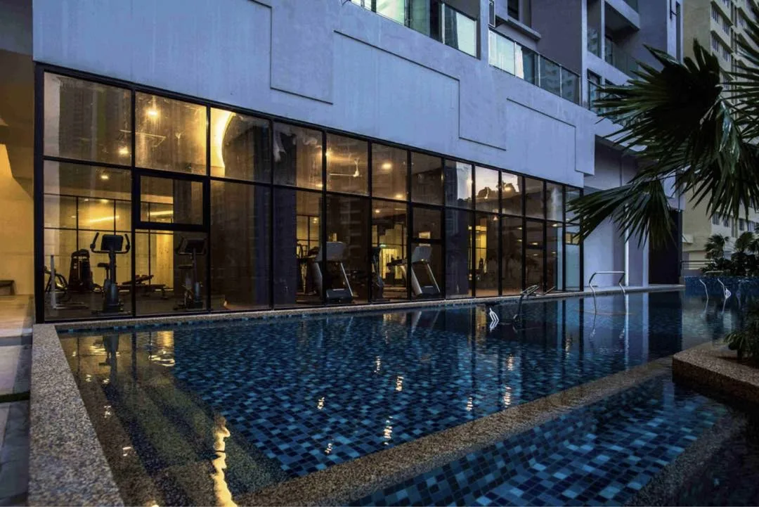 Mont Residence swimming pool with the glass-walled gymnasium beside it, Tanjung Tokong, Penang