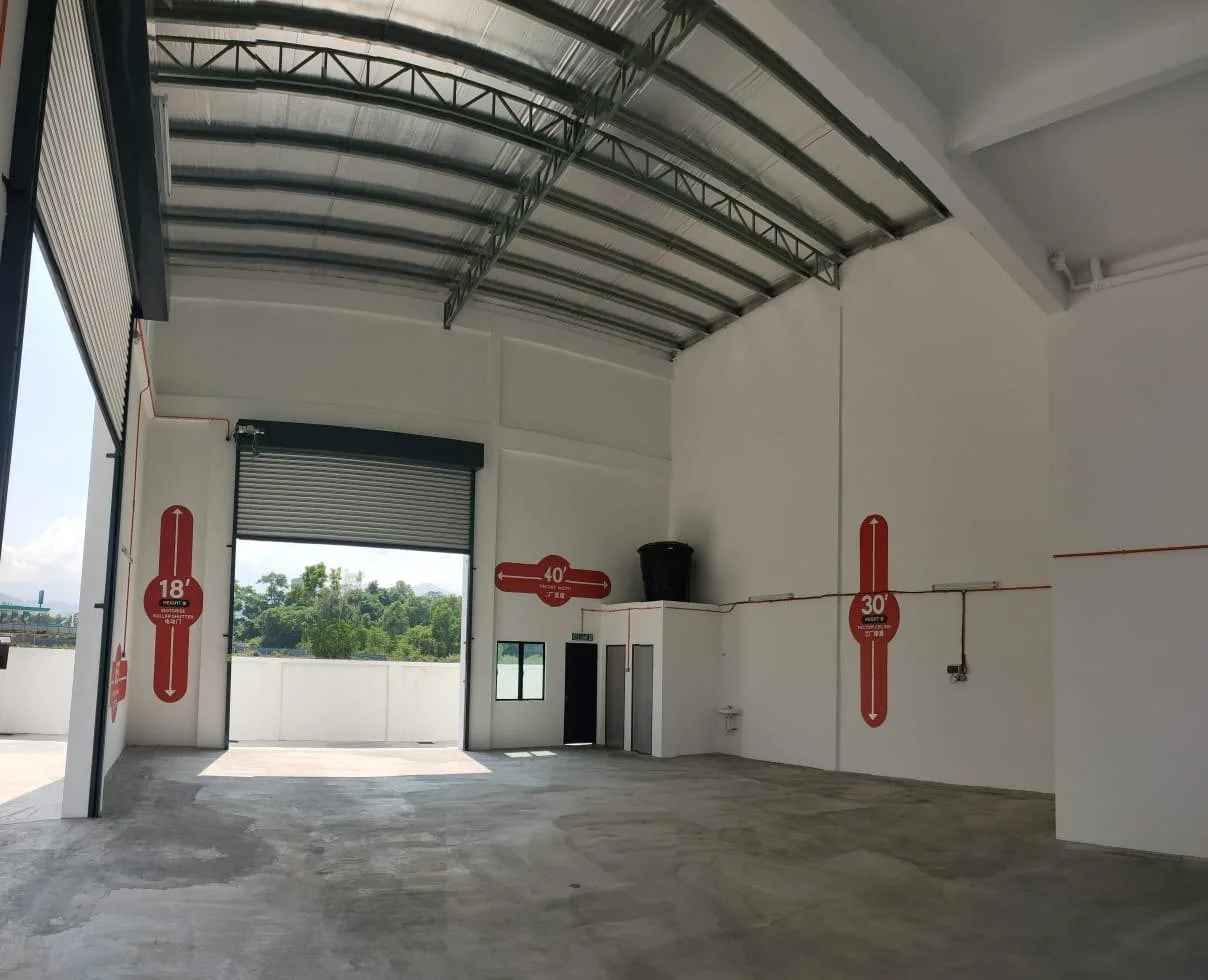 Workshop floor of the completed semi-detached show factory with roller shutter and height markings, Nexus Industry Hub, Gopeng, Perak
