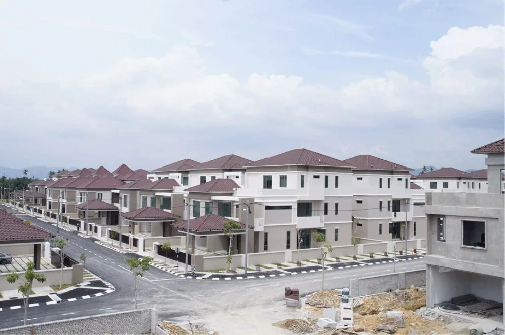 Orchard Villa completed detached houses along an estate road with one house still under construction, photographed by the developer in 2013, Simpang Ampat, Penang