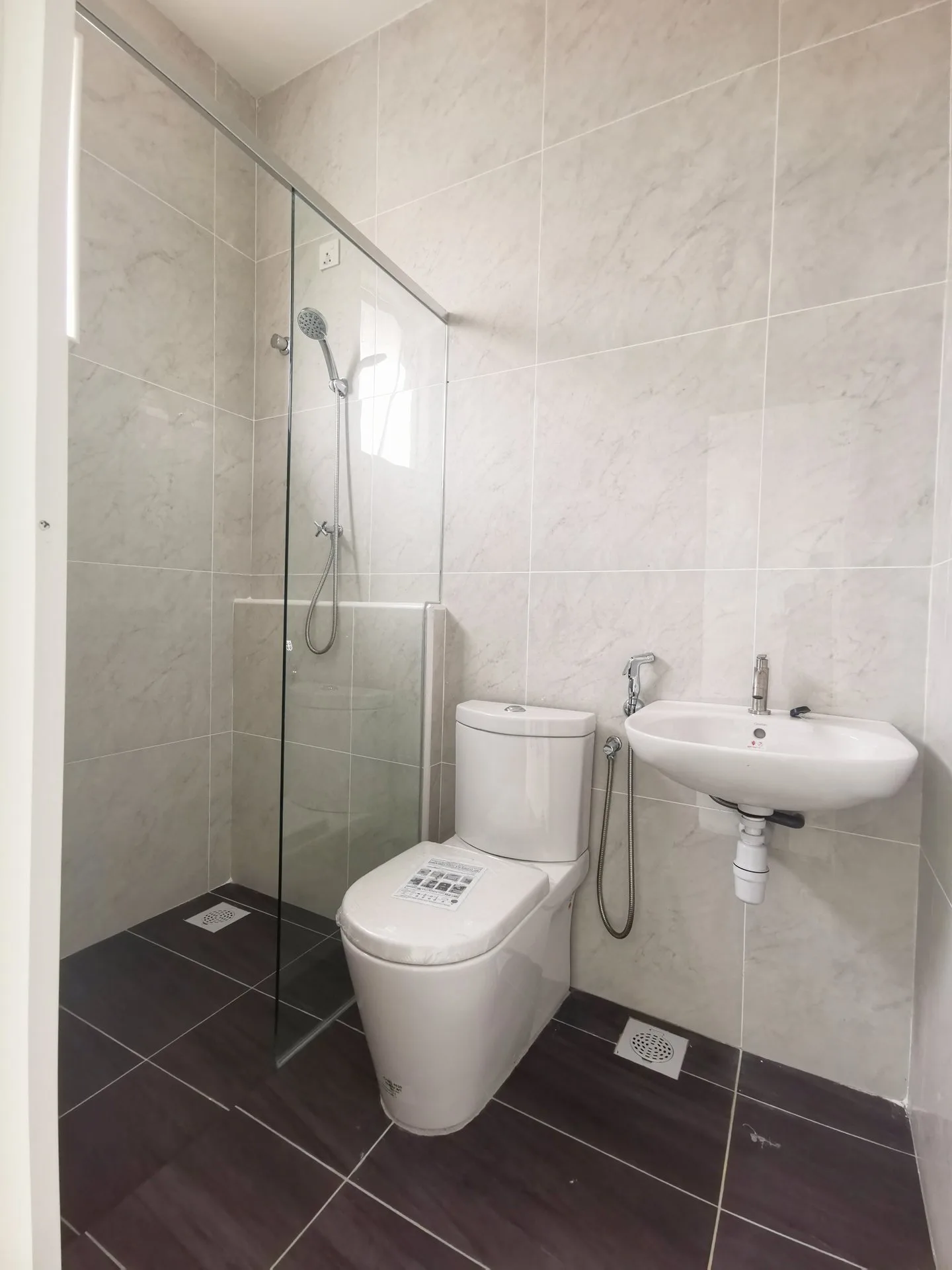 Bathroom with glass shower screen in a completed Pearl Garden terrace house, Ipoh