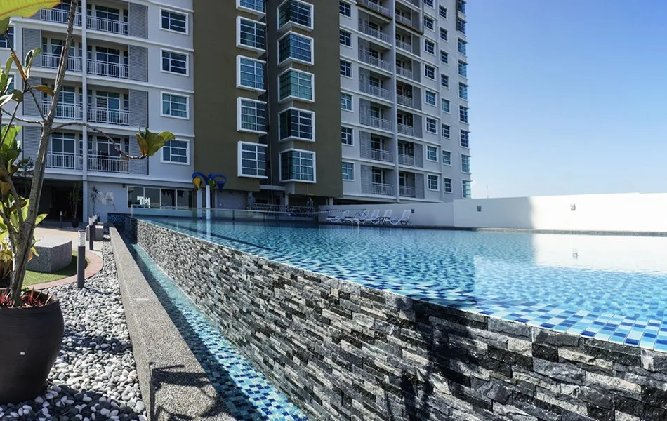 Primero Heights swimming pool deck with the residential tower behind, Seberang Jaya, Penang