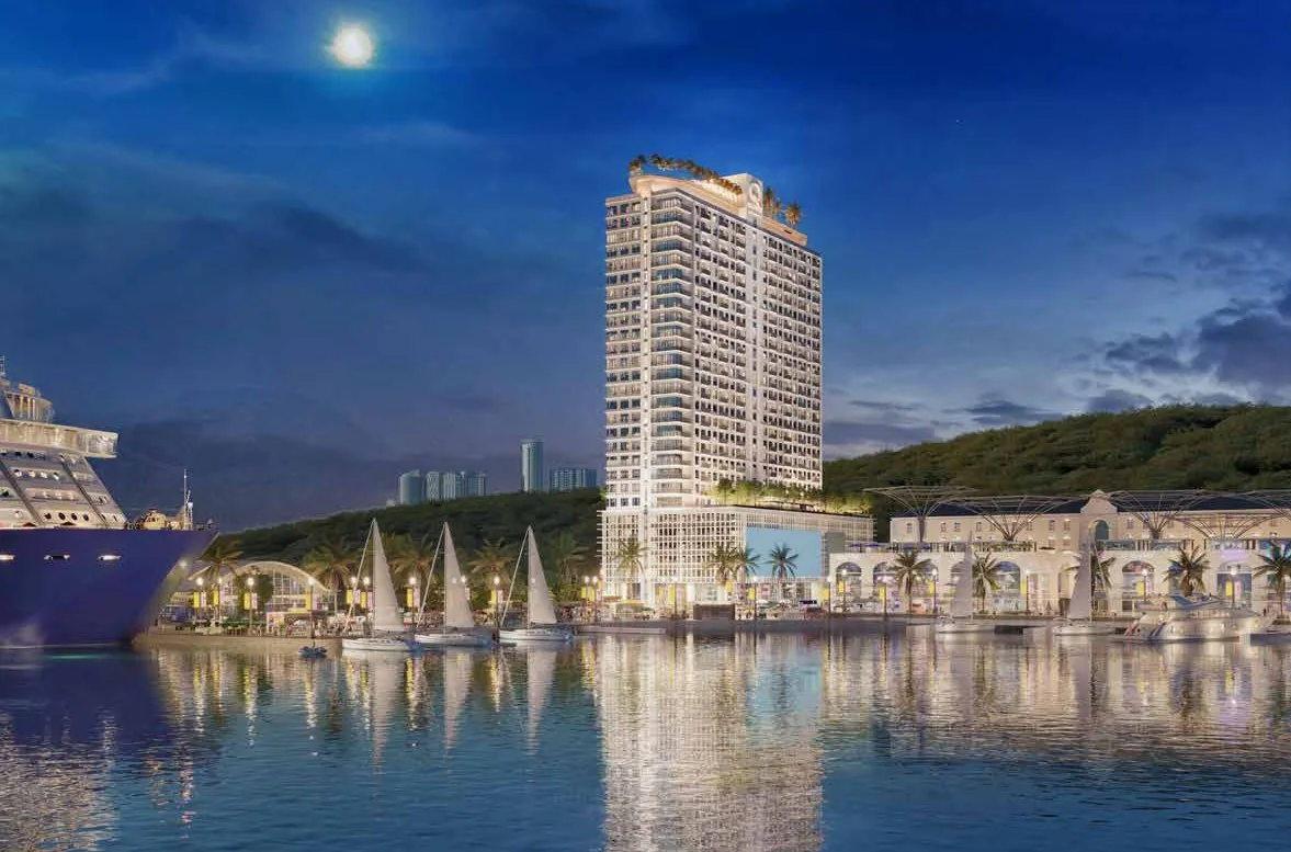 Artist’s impression of the Q Suites tower at night across the water, from the developer’s brochure at Q Suites @ Jesselton Quay, Jalan Tun Fuad Stephens, Kota Kinabalu, Sabah