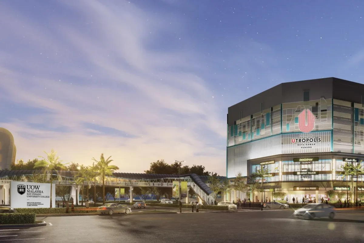 Utropolis Batu Kawan front facade at dusk with the covered walkway and the UOW Malaysia KDU sign, artist's impression, Batu Kawan, Penang