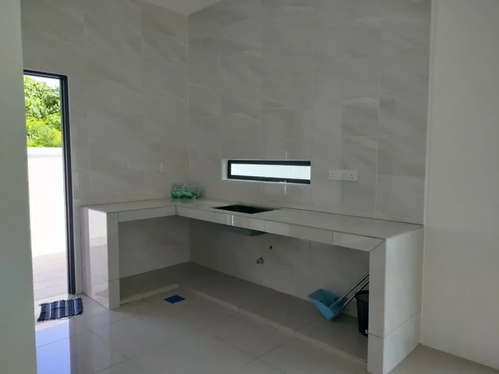 Fully tiled wet kitchen with concrete counter in a single-storey semi-D at Taman Anda by 3Peak Construction Sdn Bhd, Tasek, Ipoh, Perak