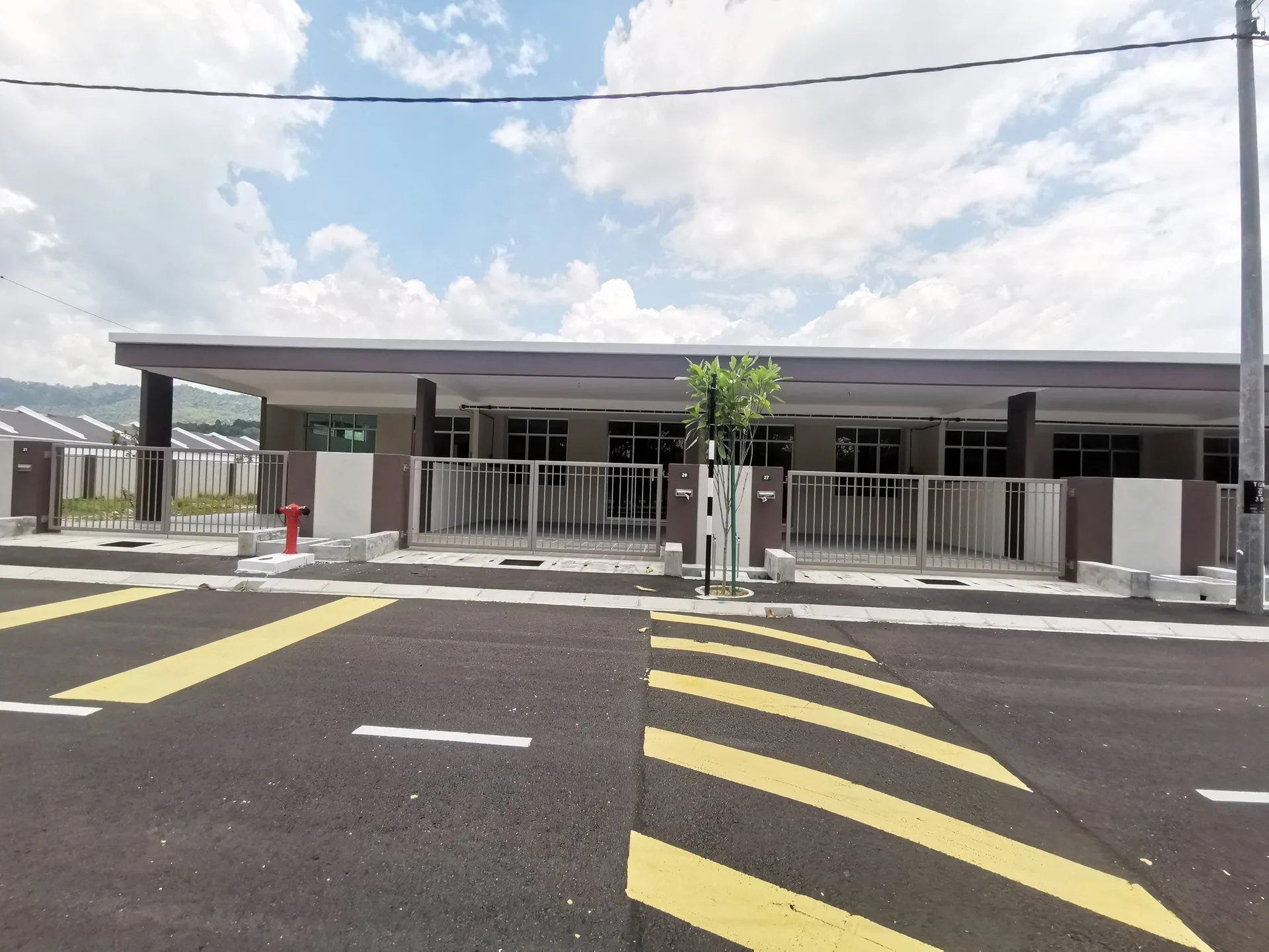 Completed single-storey terrace row on Jalan Gopeng Mewah, Taman Gopeng Mewah by Harmony Symbolic Sdn Bhd, Gopeng, Perak, photographed 12 March 2026