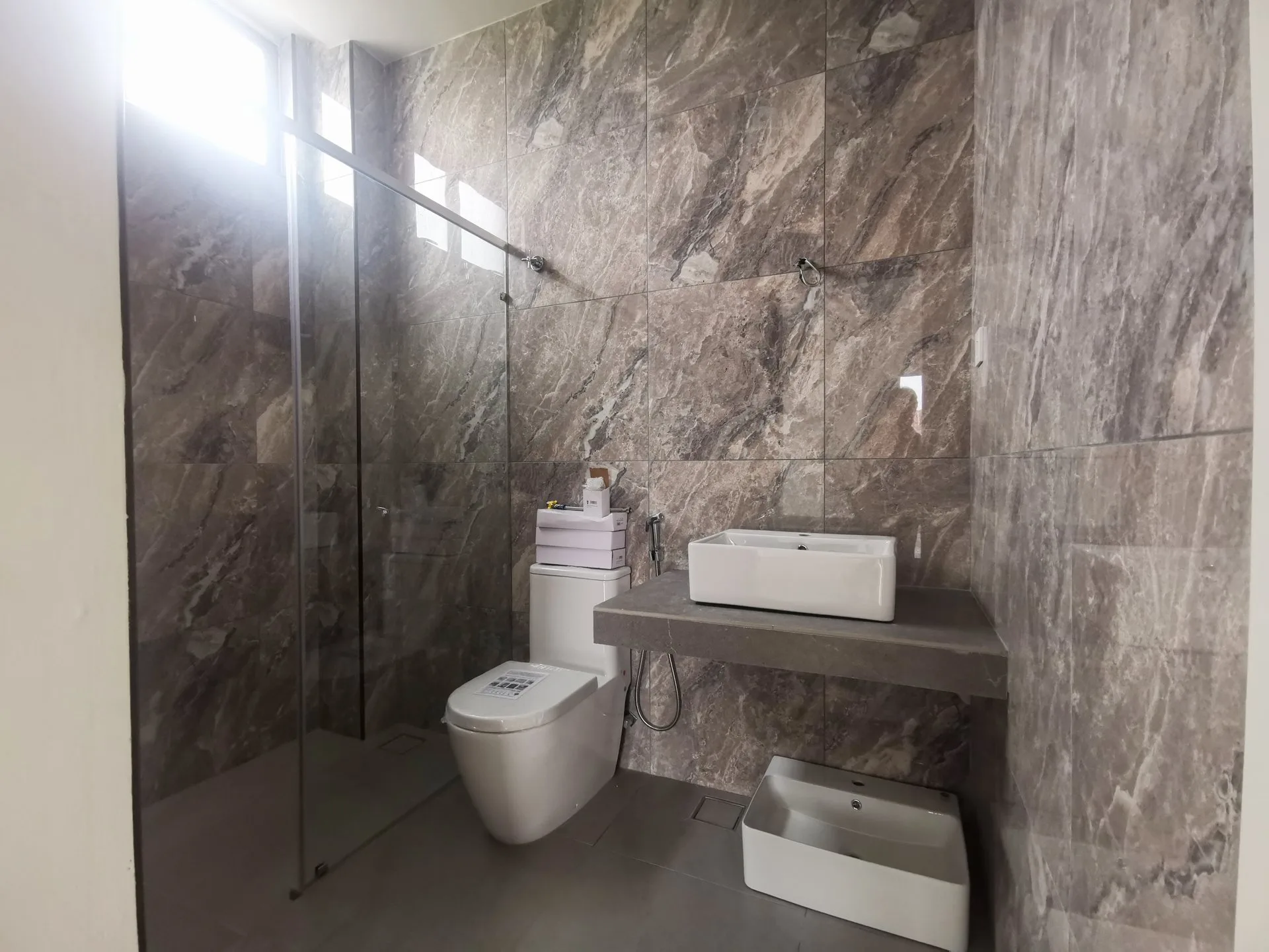 Master bathroom with shower enclosure in a completed semi-detached unit at The Aster @ Taman Sinfar by Constant Builder Sdn Bhd, Jalan Pasir Puteh, Ipoh, Perak