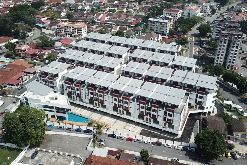 Aerial photograph of UL Residence, rows of four-storey townhouses with a pool, Air Itam, Penang — from the developer's project page
